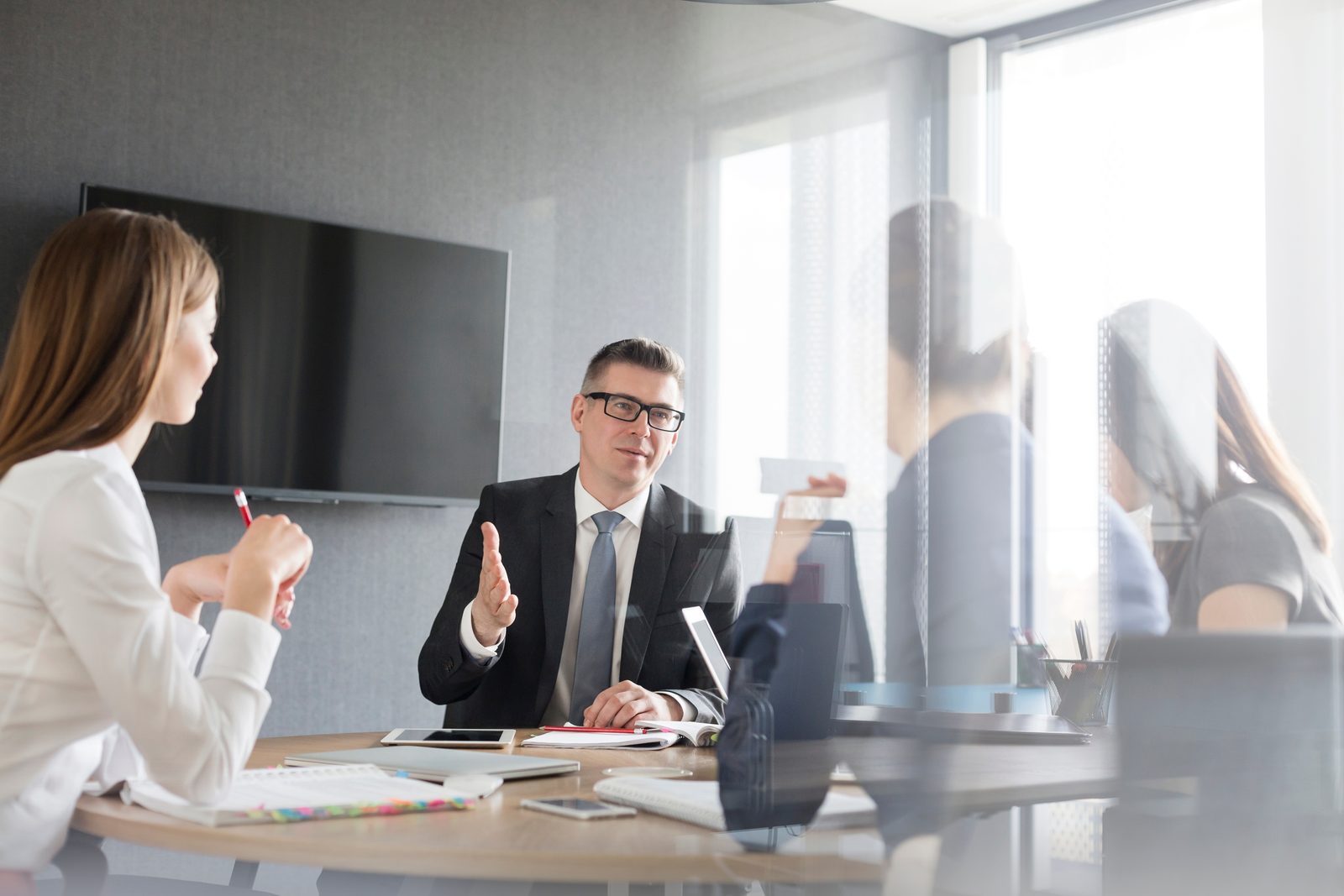 A benefits review discussion in a modern boardroom
